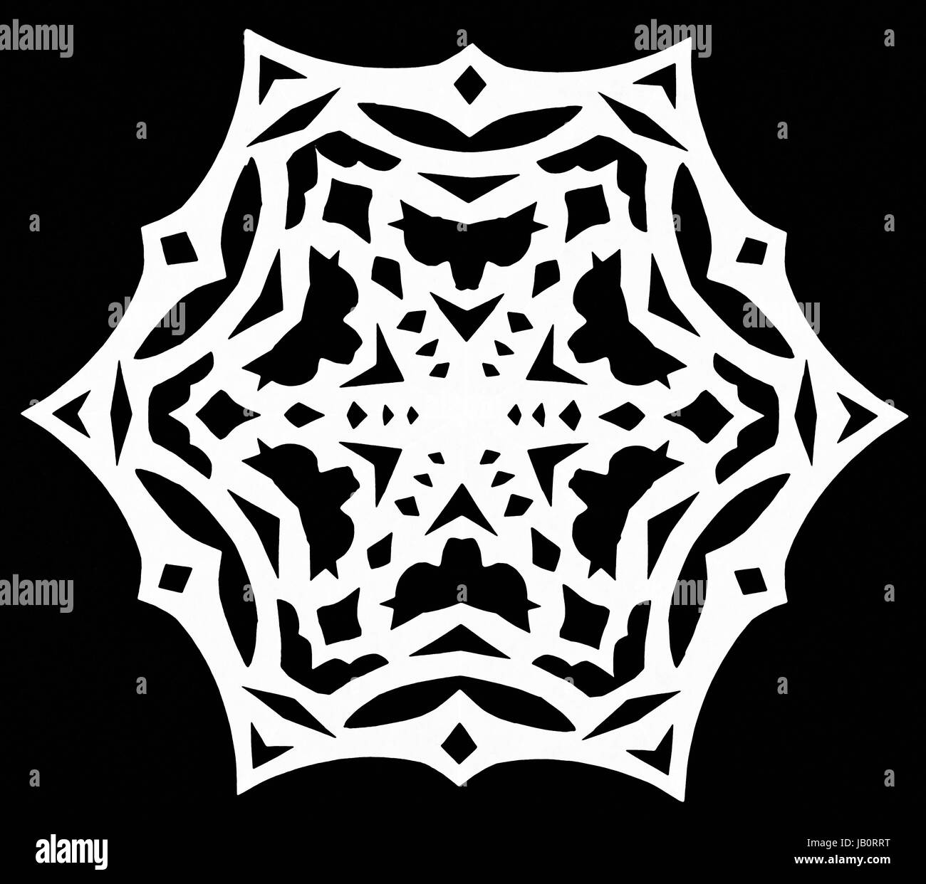 hand made cut out white snowflake on black paper background Stock Photo ...