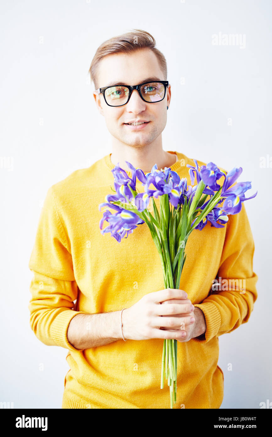 Handsome Guy with Beautiful Irises Stock Photo