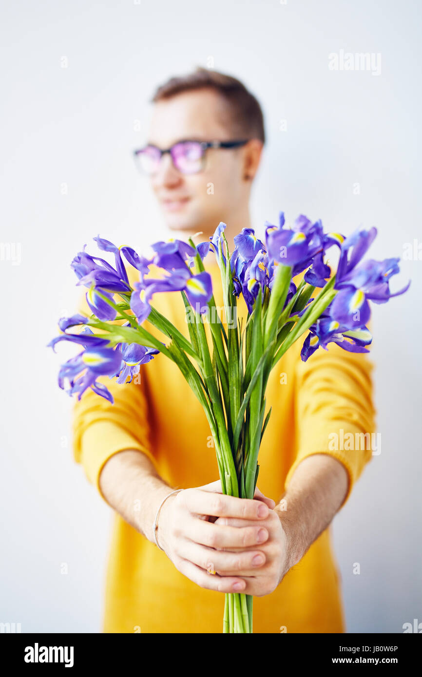 Young Man with Beautiful Spring Flowers Stock Photo