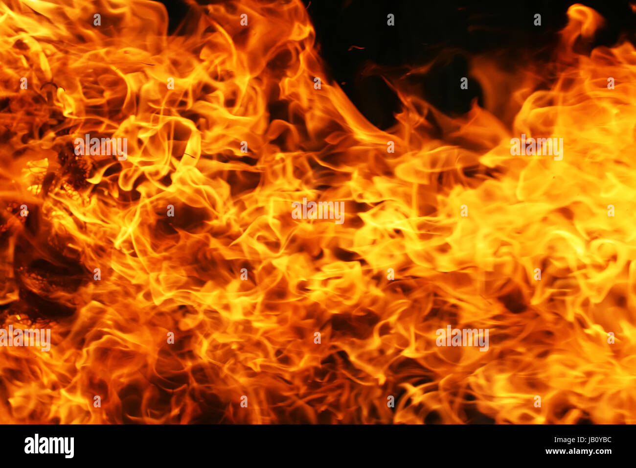 Beautiful yellow and orange hot fire on black background Stock Photo ...