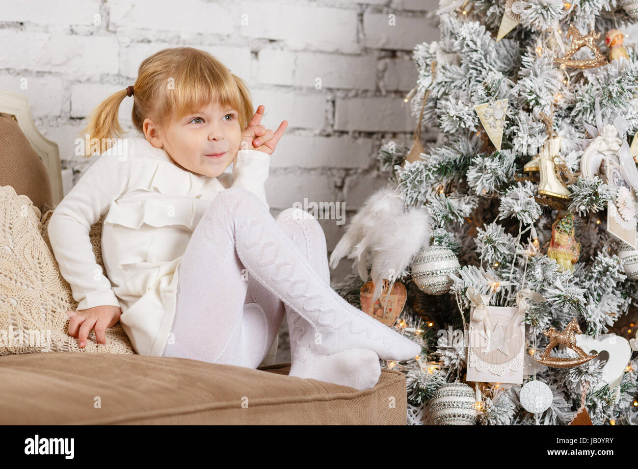 Smiling pretty girl sits in hi-res stock photography and images - Alamy