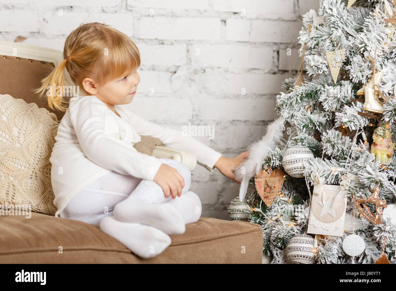 Smiling pretty girl sits in hi-res stock photography and images - Alamy