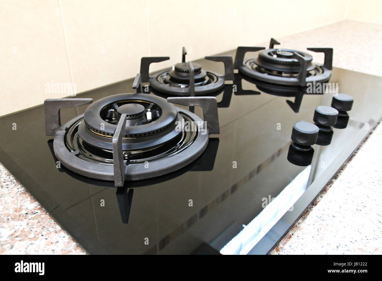 Black glass gas hob in kitchen Stock Photo Alamy