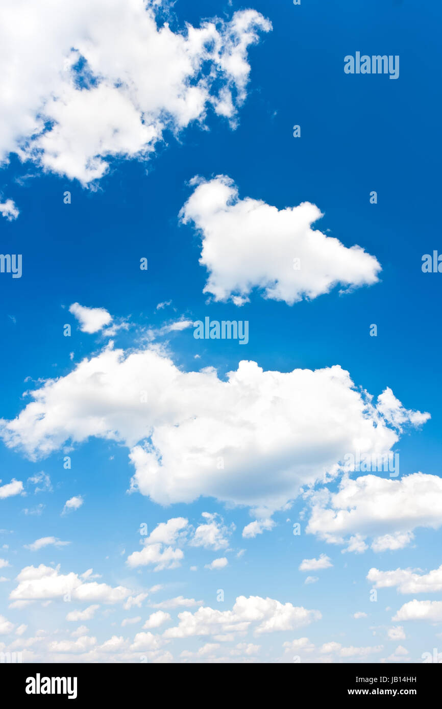 White clouds in blue summer sky background Stock Photo - Alamy