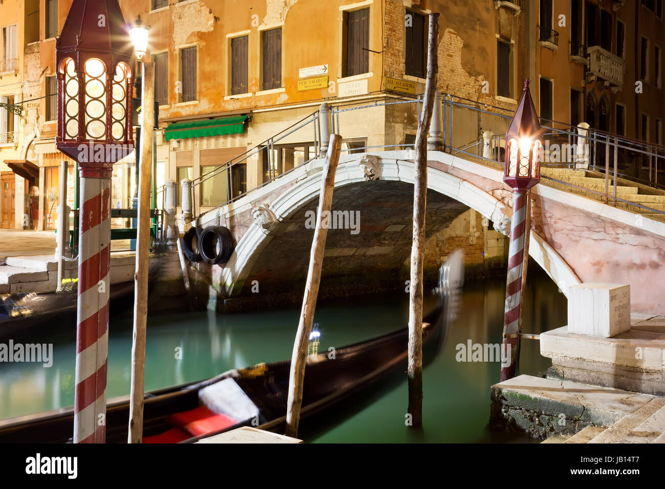 View of beautiful Venetian canal at night, Venice, Italy Stock Photo ...