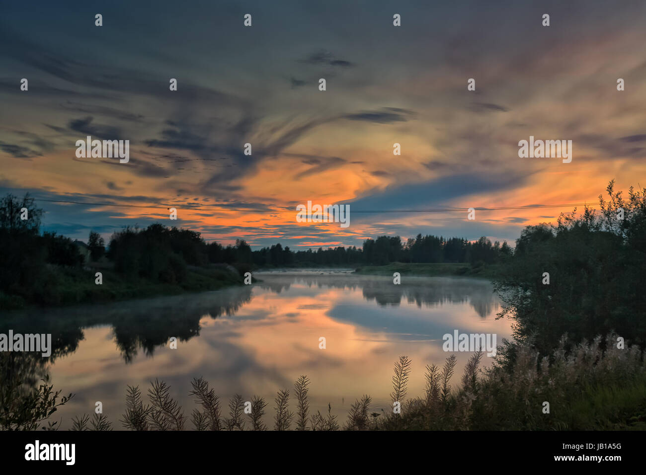 A Beautiful Late Summer Sunset Over The Still Water Of The River Pyhajoki In The Northern Finland The Ducks Are Flying Over The Water And Preparing T Stock Photo Alamy