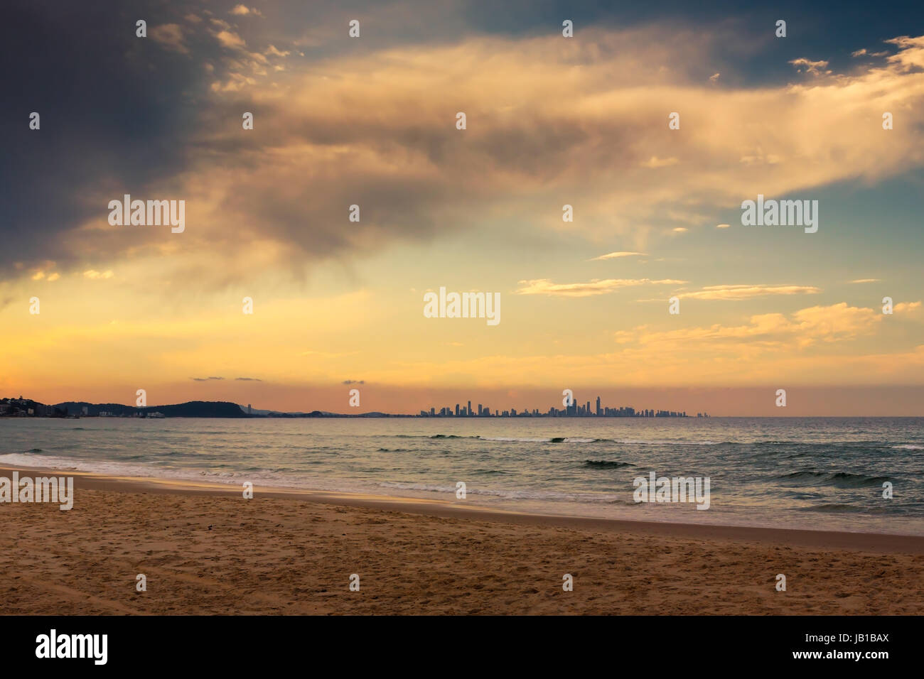 The skyline of the city of Gold Coast can be seen in the horizon from a beach in Coolangatta, QLD, Australia. A place well worth visiting. Stock Photo