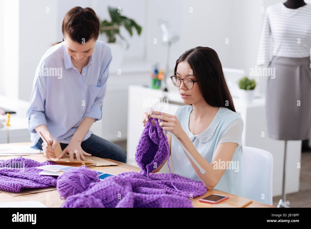 Young women enjoying their work time Stock Photo