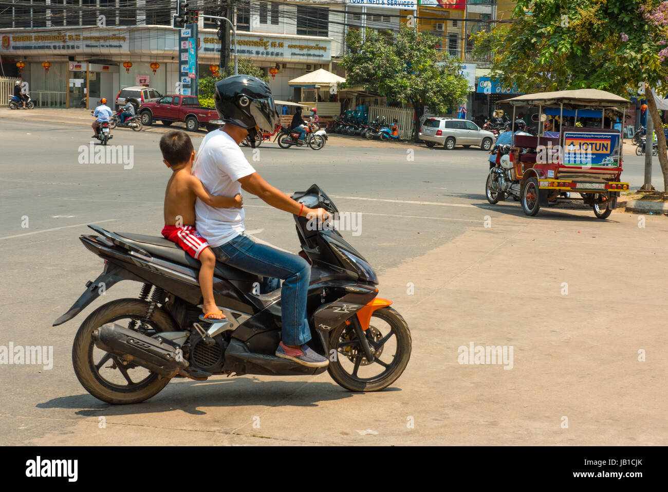 little boy riding motorcycle
