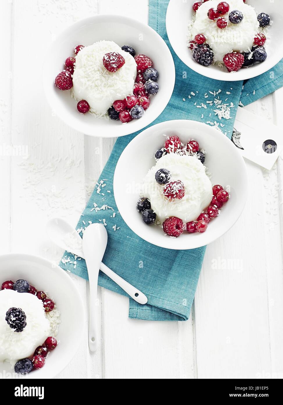 Yoghurt coconut jelly with berries Stock Photo Alamy