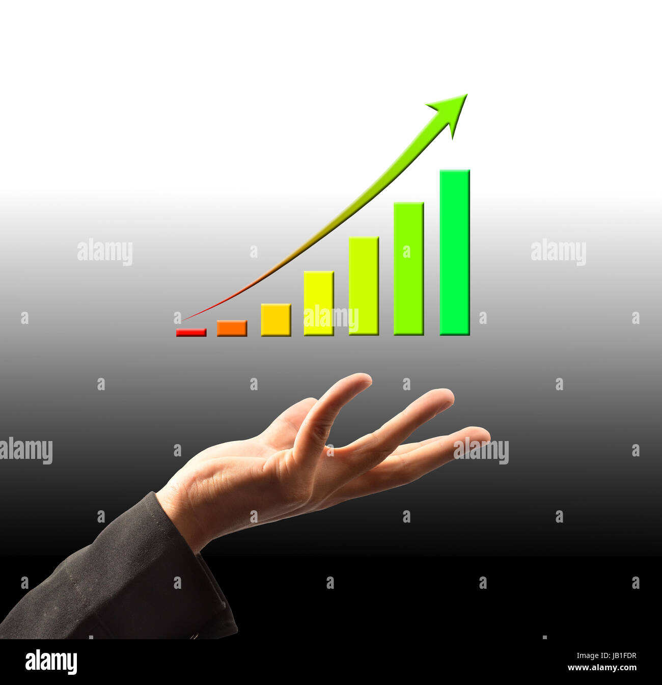 Businessman holding a growing graph Stock Photo - Alamy