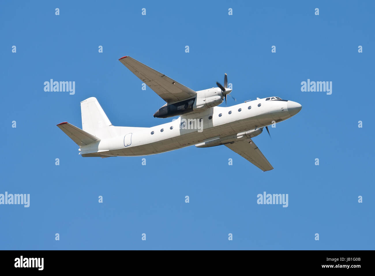 Beautiful white passenger airplane in blue sky Stock Photo - Alamy