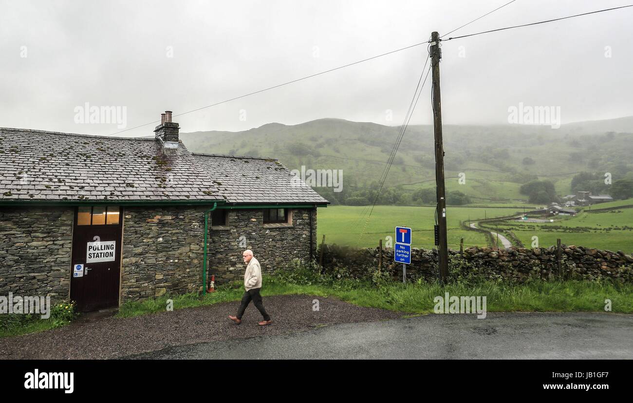 Voters arrive at a polling station in Kentmere, Cumbria to cast their votes in the General Election. Stock Photo