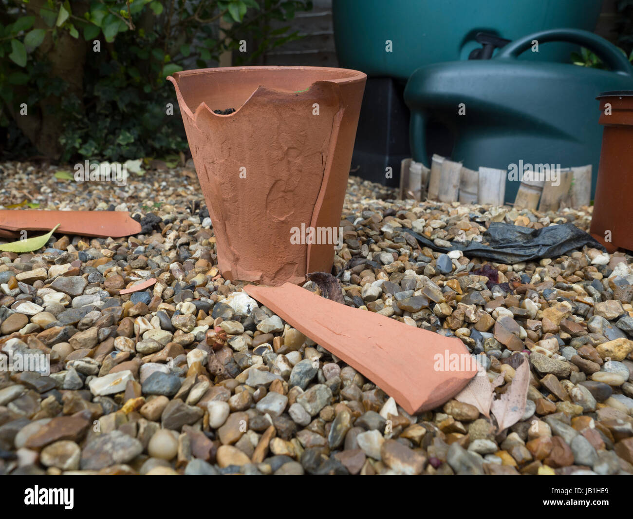 A garden flower pot cracked and broken by winter frost Stock Photo Alamy