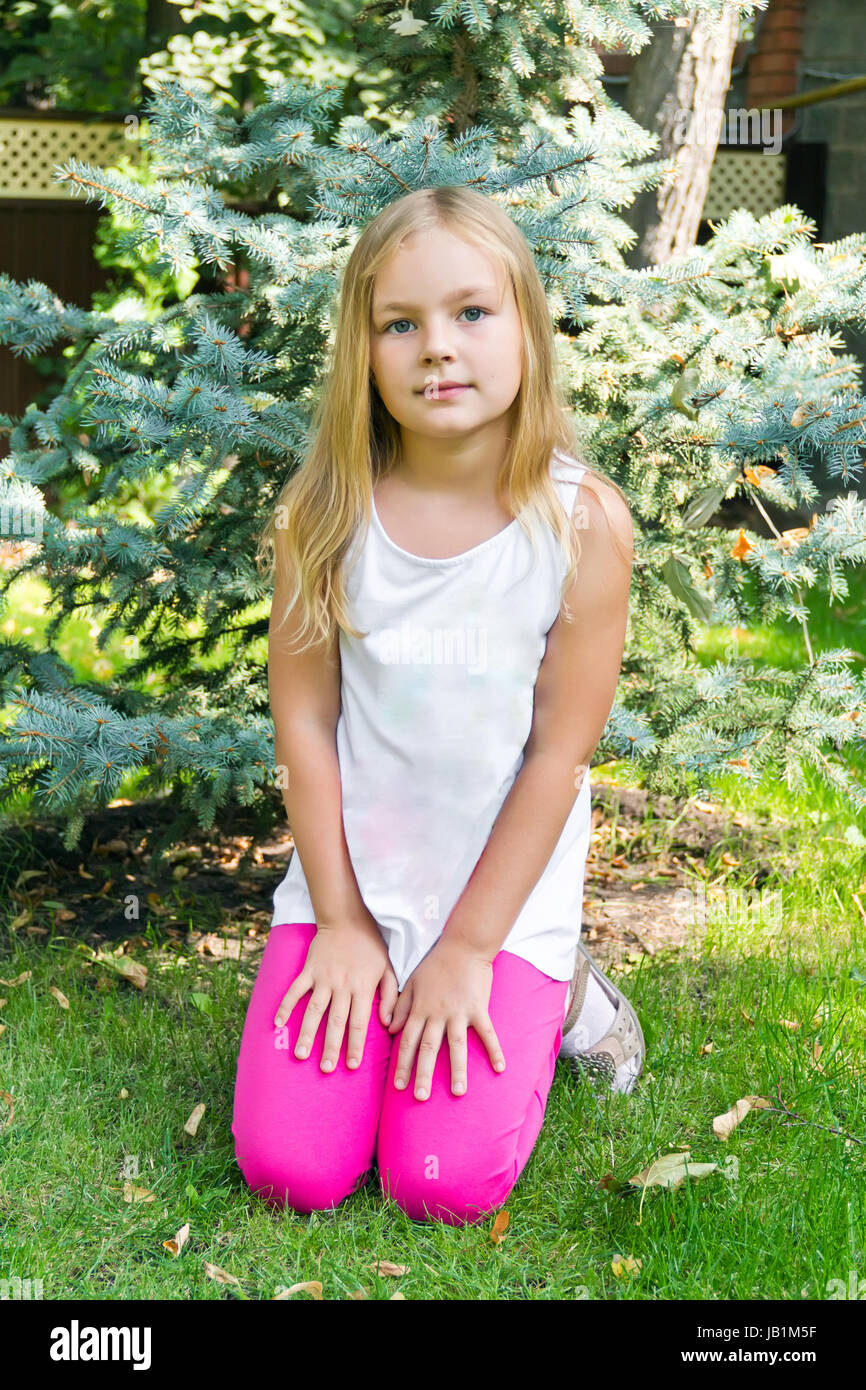 Cute girl with blond long hair and blue eyes Stock Photo - Alamy