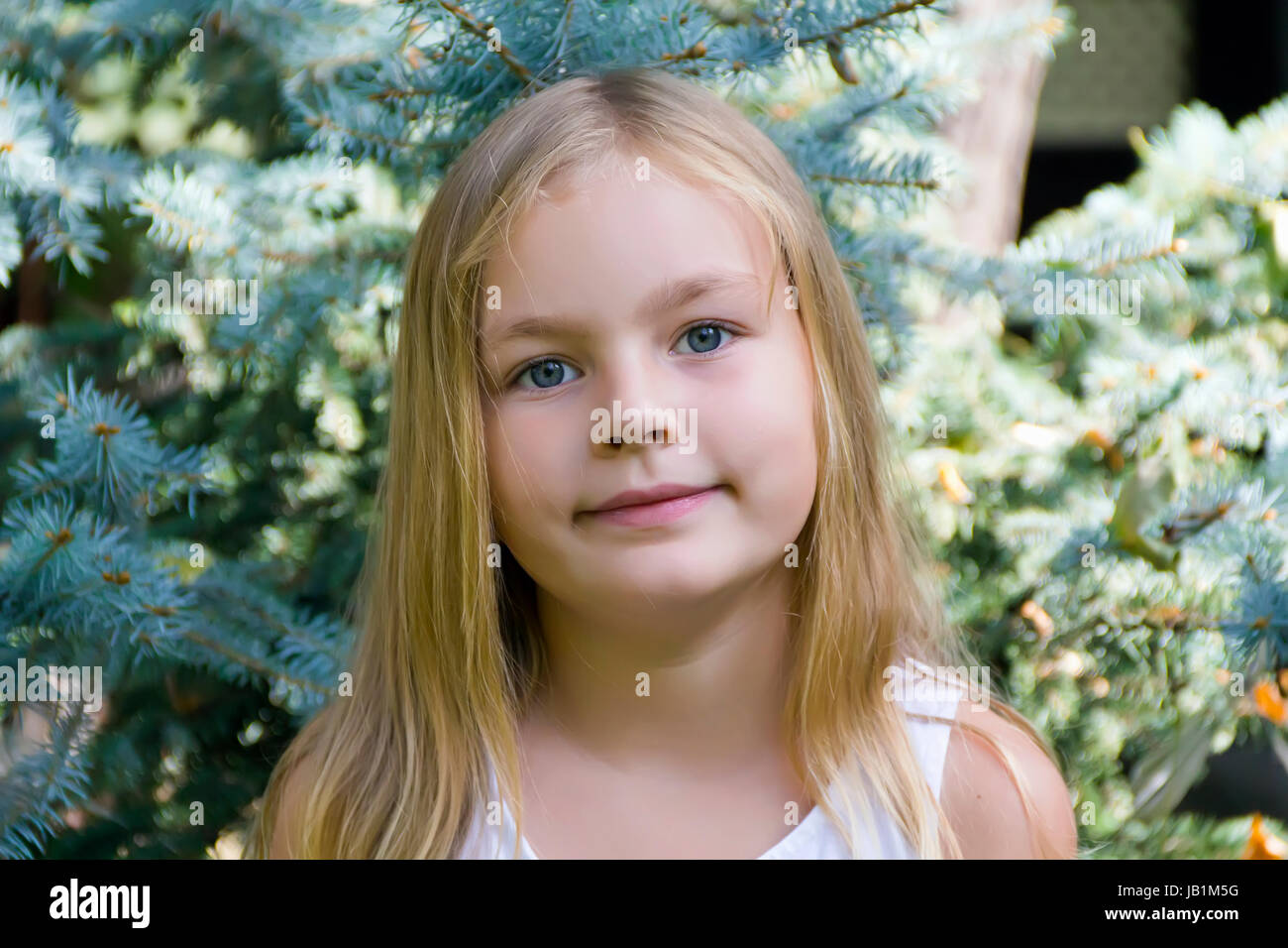 Portrait of girl with blond hair and blue eyes Stock Photo - Alamy