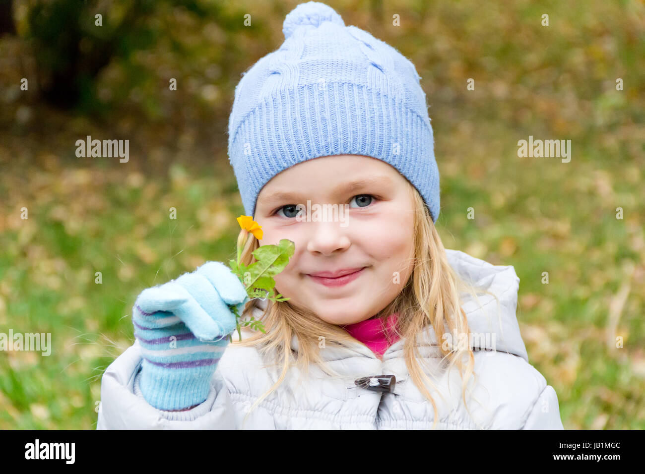 Photo of cute smiling girl in autumn Stock Photo - Alamy