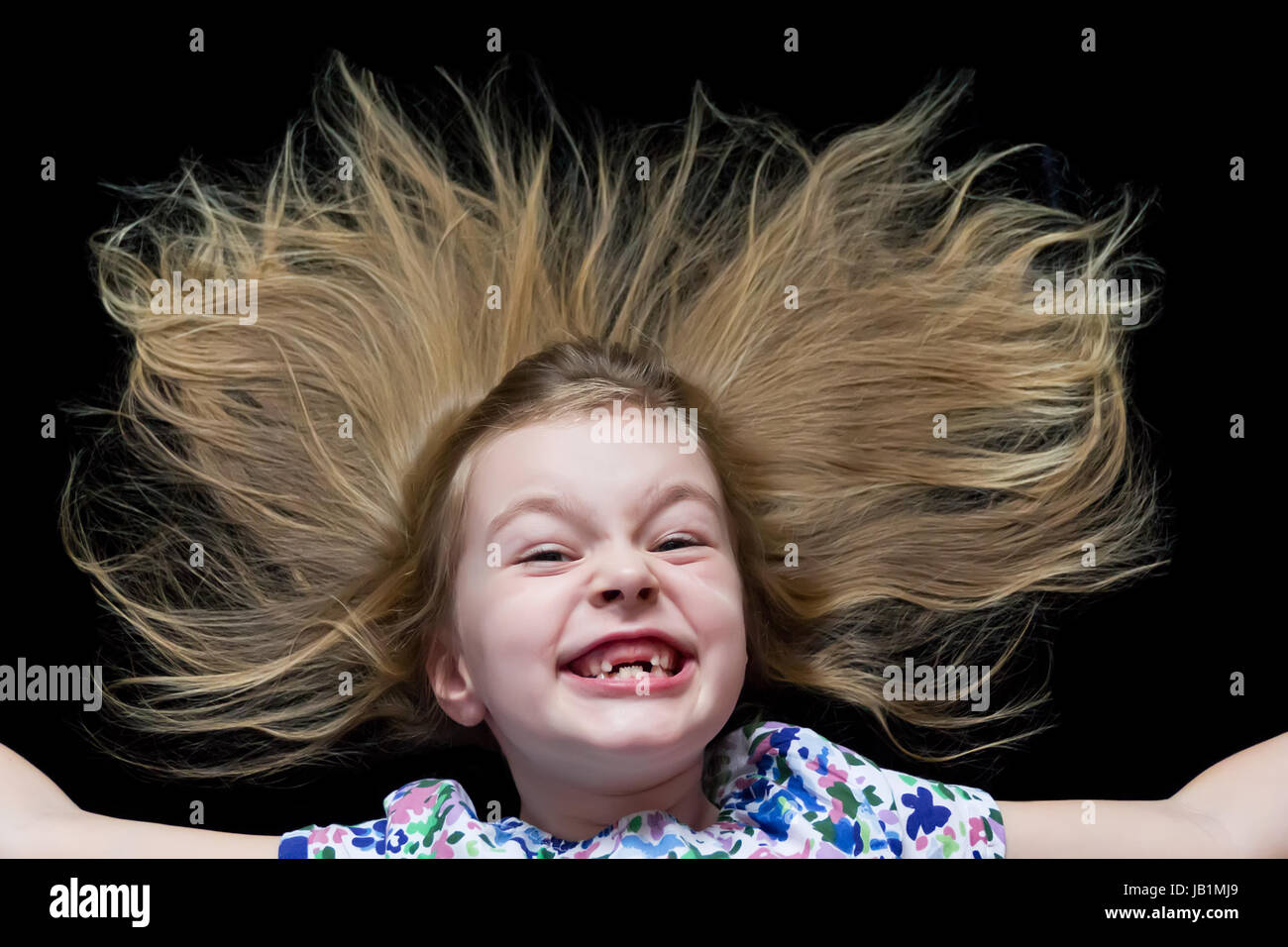 Cute beautiful girl makes faces imitate witch Stock Photo