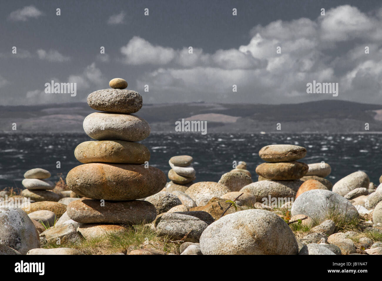 Stone piles, looking out over the Kilbrannan Sound to KIntyre in rough seas. Stock Photo