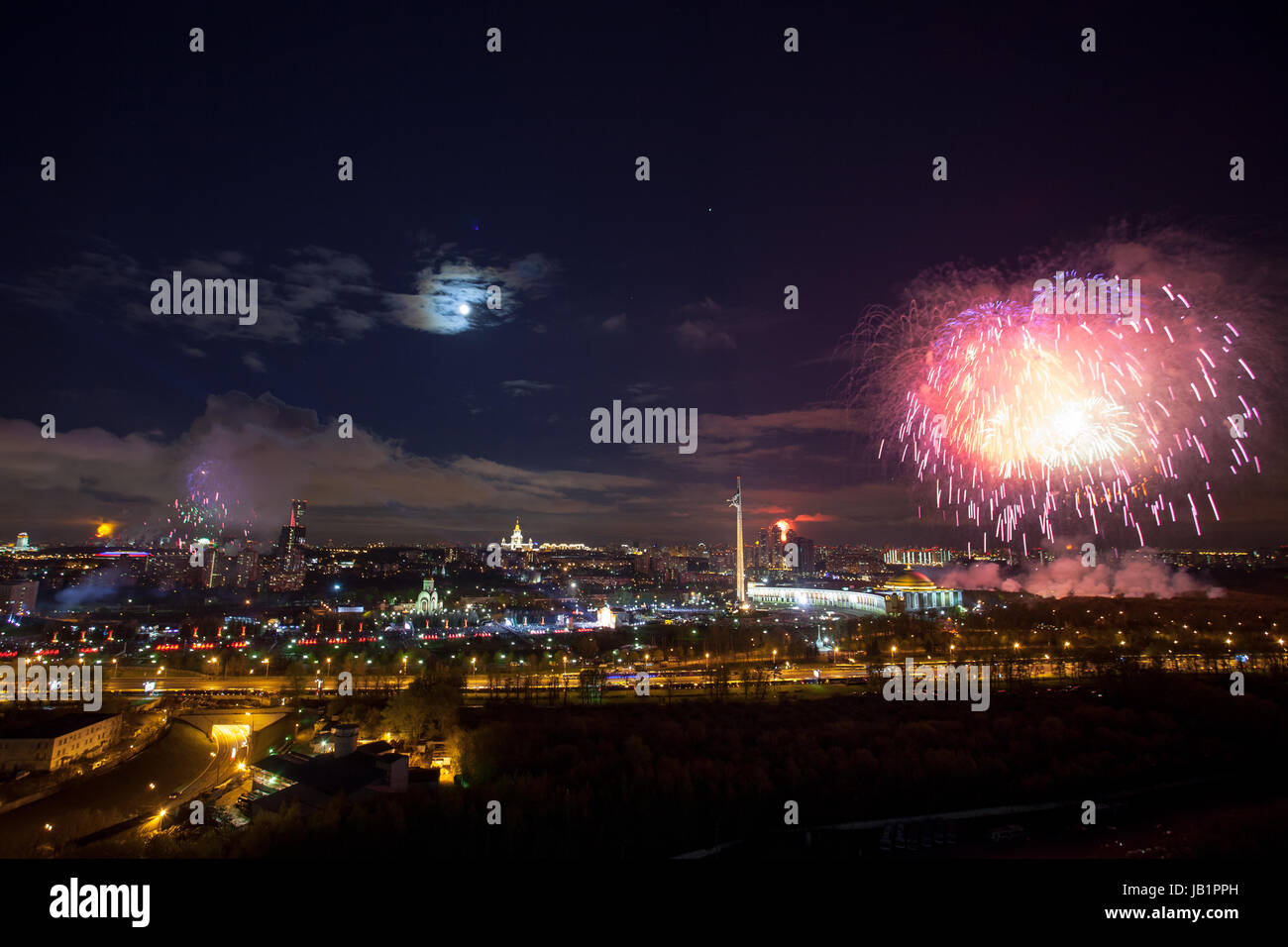 Bright fireworks explosions in night sky in Moscow, Russia Stock Photo