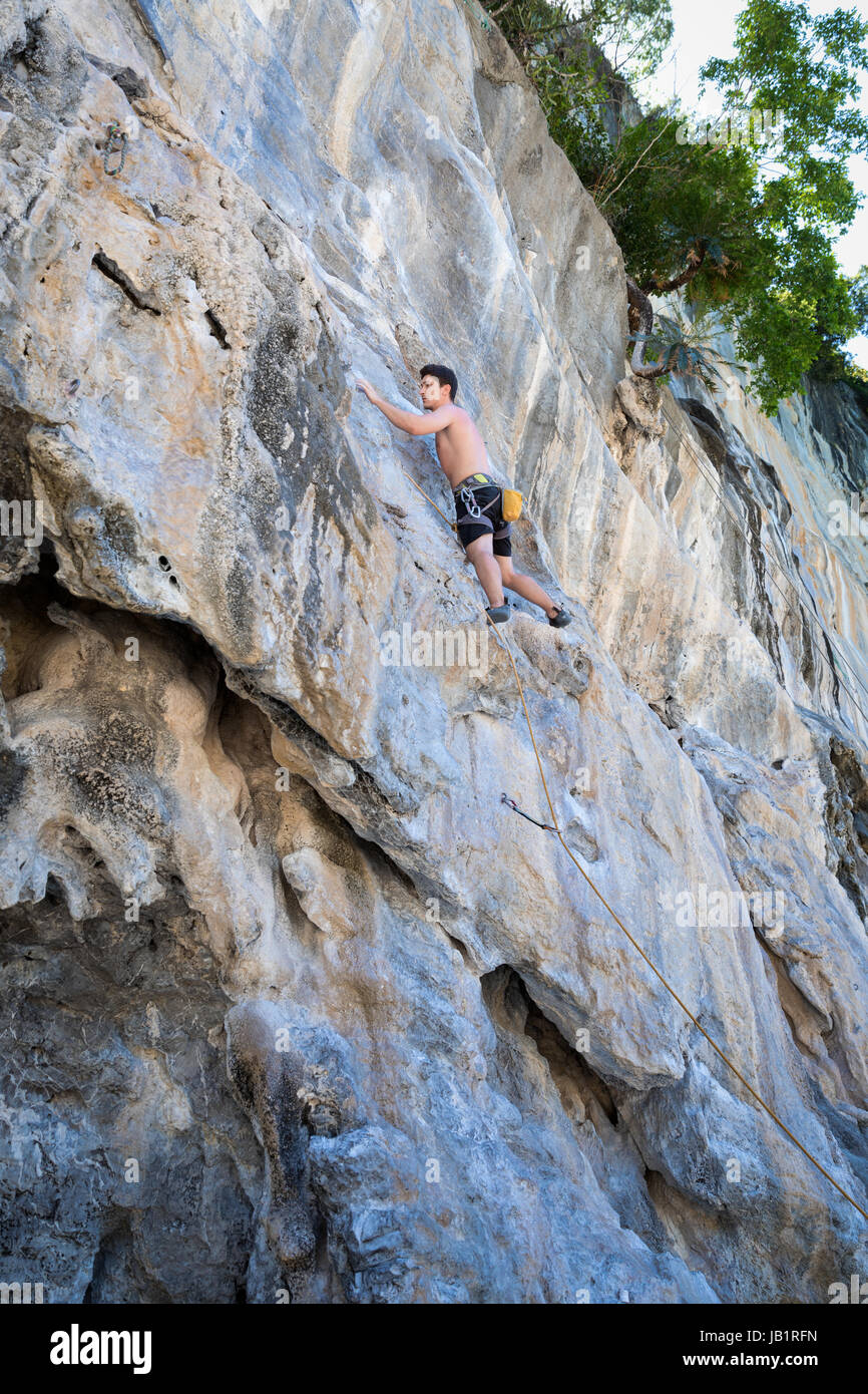 Young woman rock climbing on white mountain in Thailand Stock Photo - Alamy