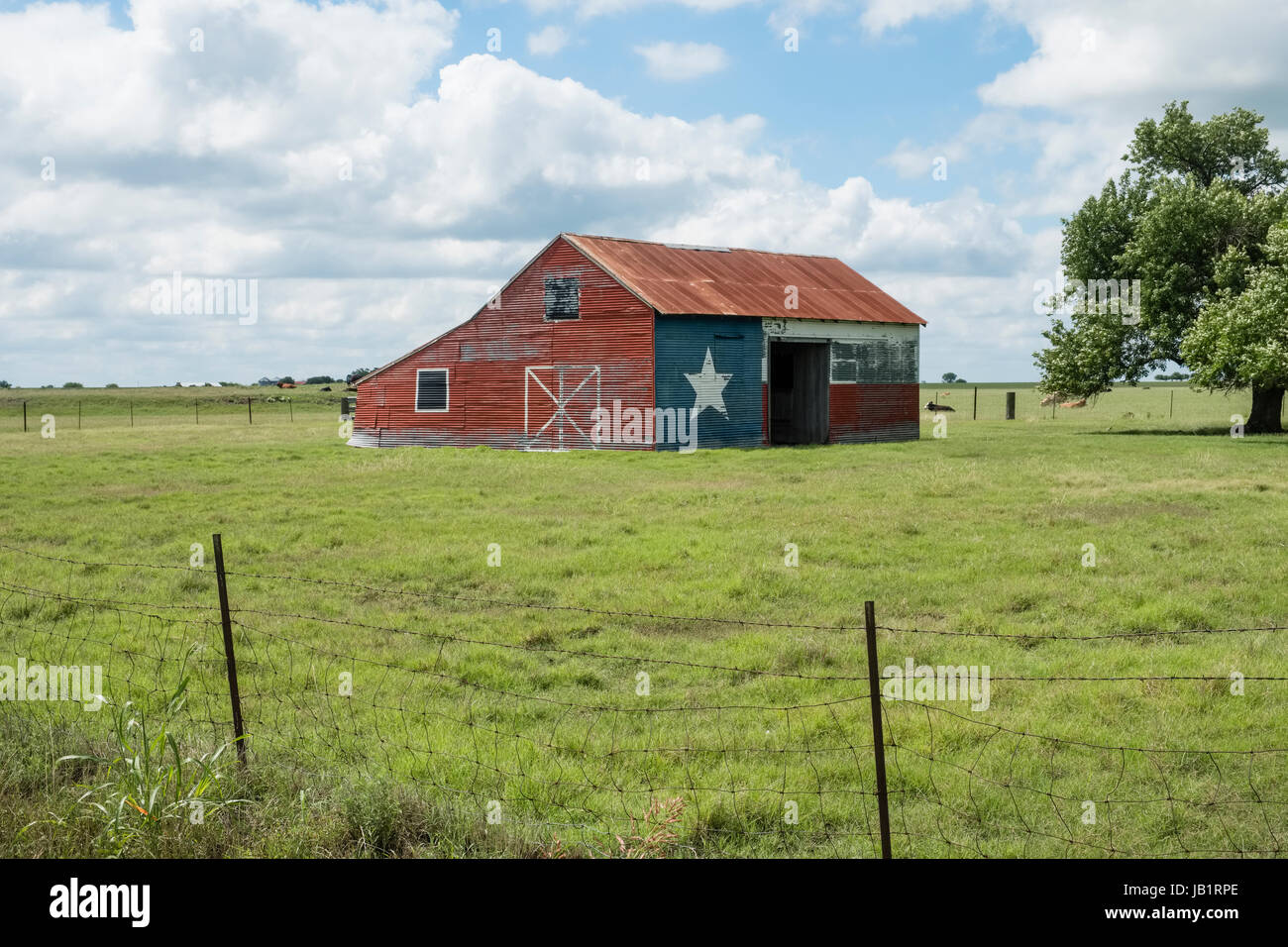 Texas Blackland Prairie farm barn painted in Texas state flag motif Stock Photo