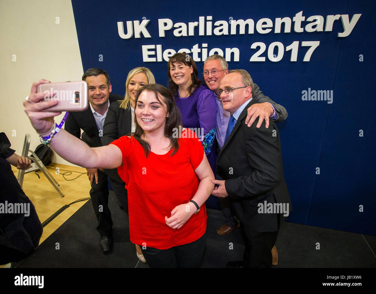 Sinn Fein's Jemma Dollan taking a selfie with (from the left) Pearse Doherty TD, Sinn Fein leader in Northern Ireland Michelle O'Neill, newly elected MP for Fermanagh & South Tyrone Michelle Gildernew, Sean Lynch, and newly elected MP for West Tyrone Barry McElduff at the Omagh Leisure Complex, Co Tyrone. Stock Photo