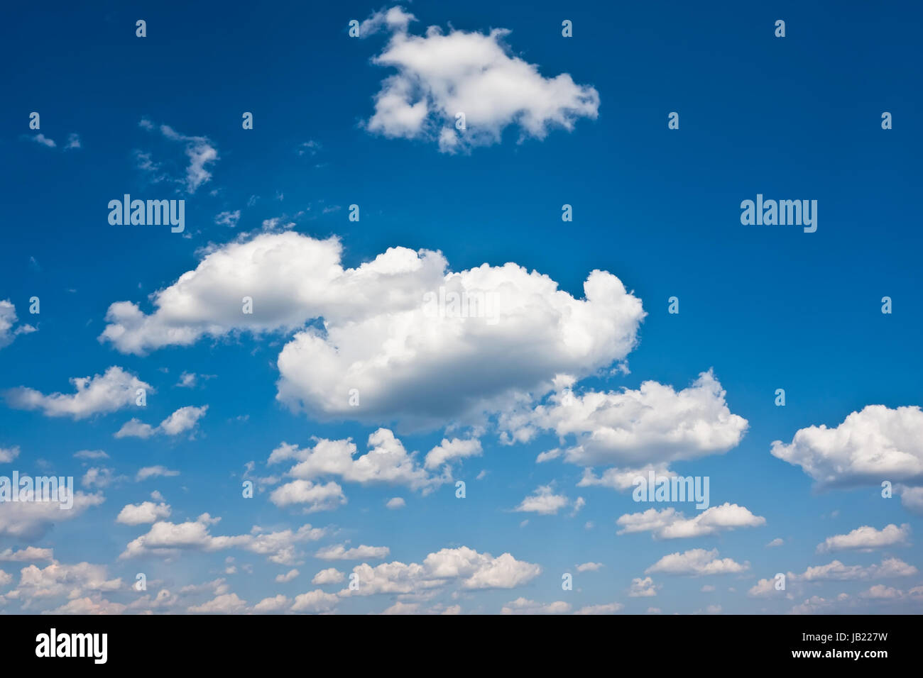 White clouds in blue summer sky background Stock Photo - Alamy