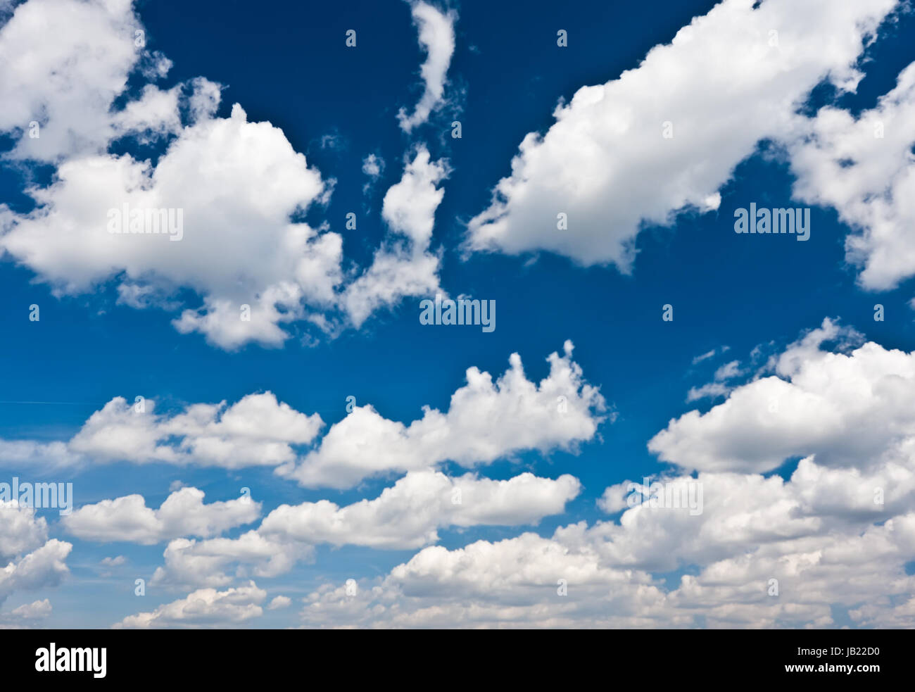 White clouds in blue summer sky background Stock Photo - Alamy
