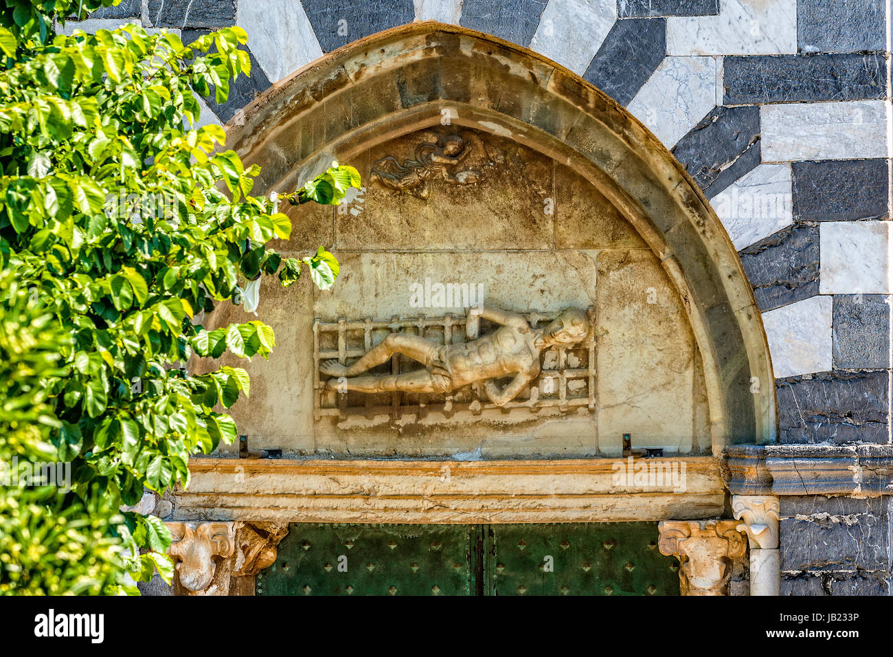 Italy Liguria Portovenere - St Lorenzo basilica ( Madonna Bianca Sanctuary  ) - Portal lunette - Sculptured the bas-relief with The martyrdom of St.  Lawrence Stock Photo - Alamy