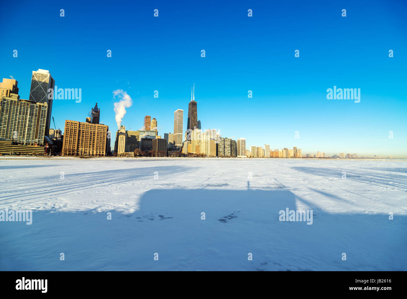 View of the Chicago skyline with frozen and snowy Lake Michigan visible ...