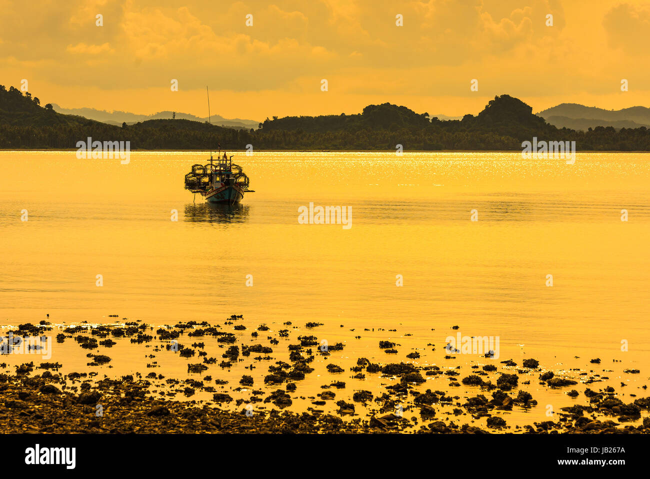 Fishing boat in the morning sea in thailand Stock Photo - Alamy