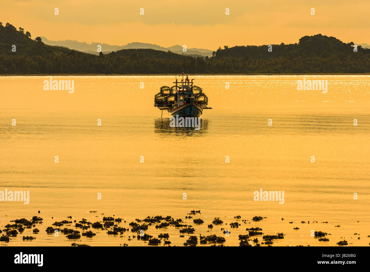 Fishing boat in the morning sea in thailand Stock Photo - Alamy