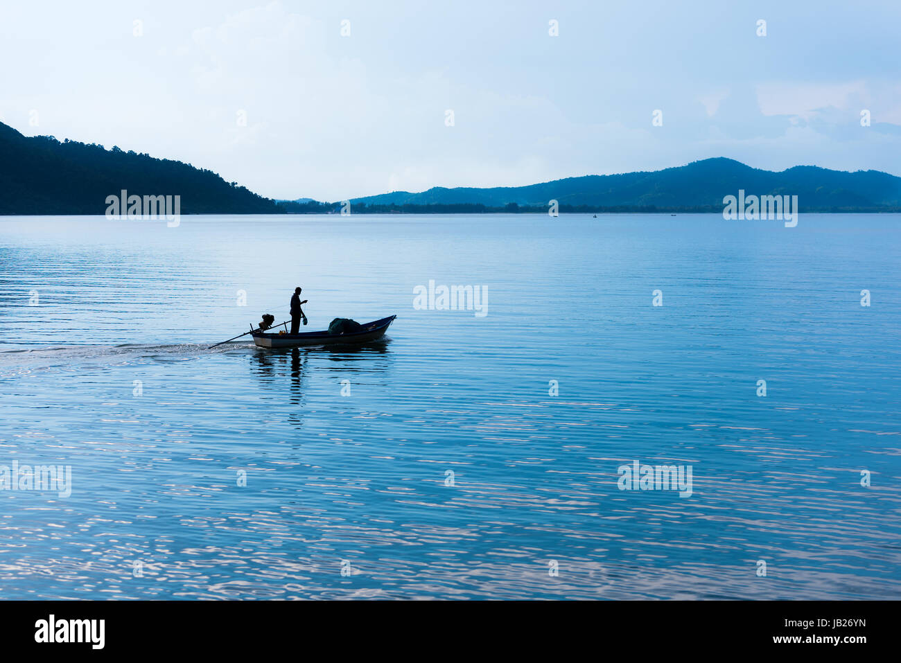 Fishing boat in the morning sea in thailand Stock Photo - Alamy