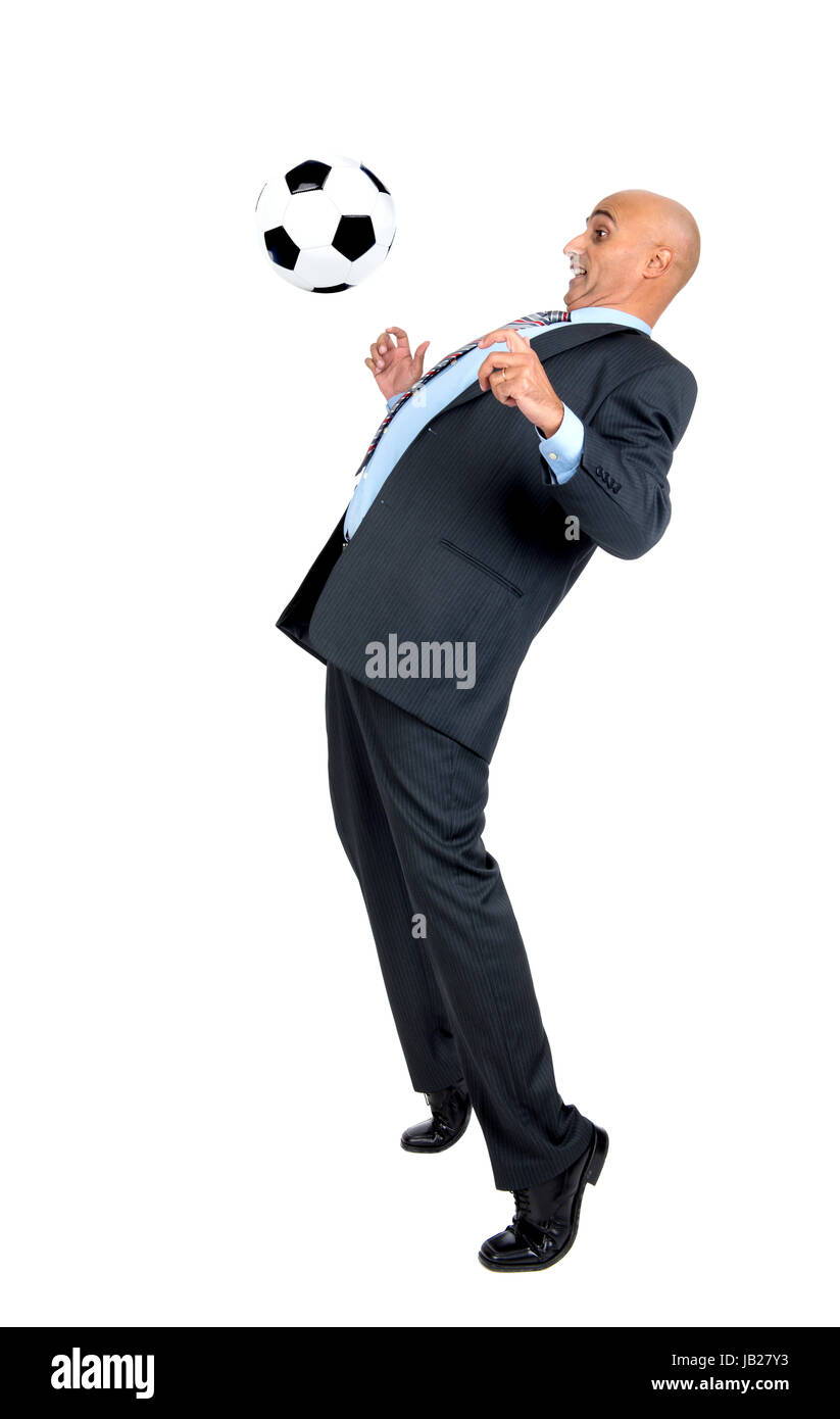Businessman playing soccer ball isolated in white Stock Photo - Alamy