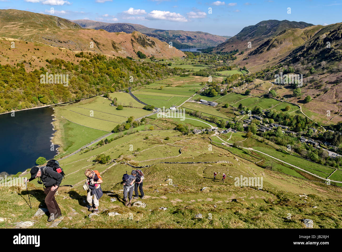 Walkers climbing Hartsop Dodd  in the Lake District national park Stock Photo