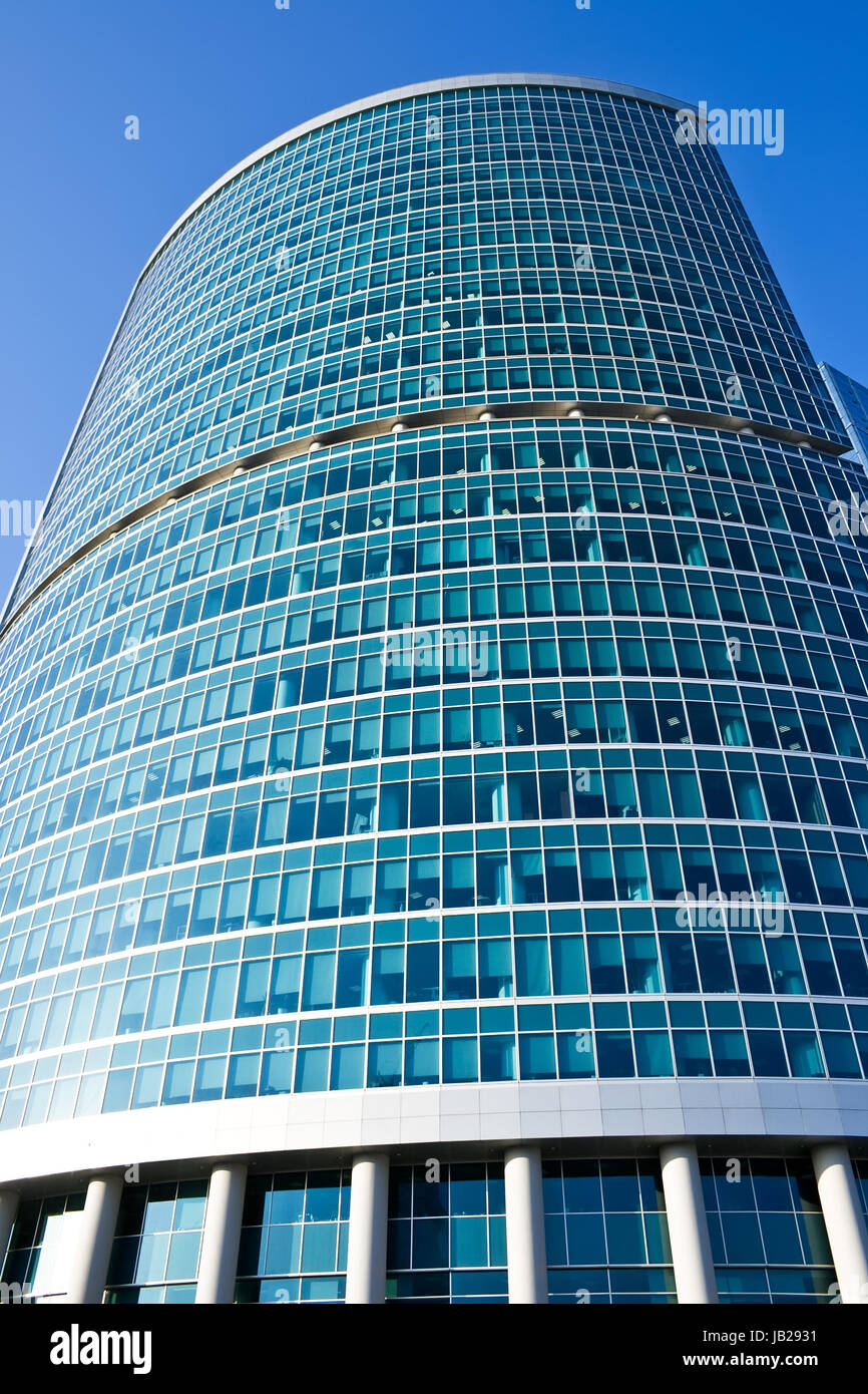 High modern skyscraper under blue sky Stock Photo - Alamy