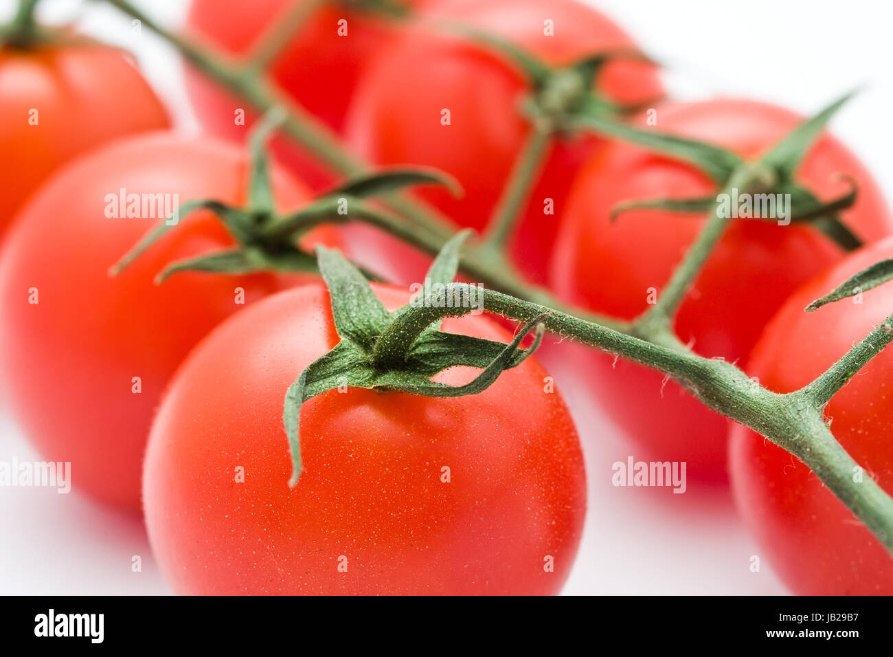 Fresh tomatos isolated on white background Stock Photo - Alamy