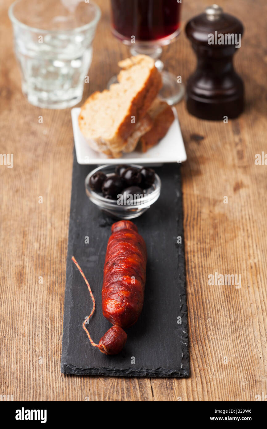 spanish chorizo sausage on black slate Stock Photo - Alamy