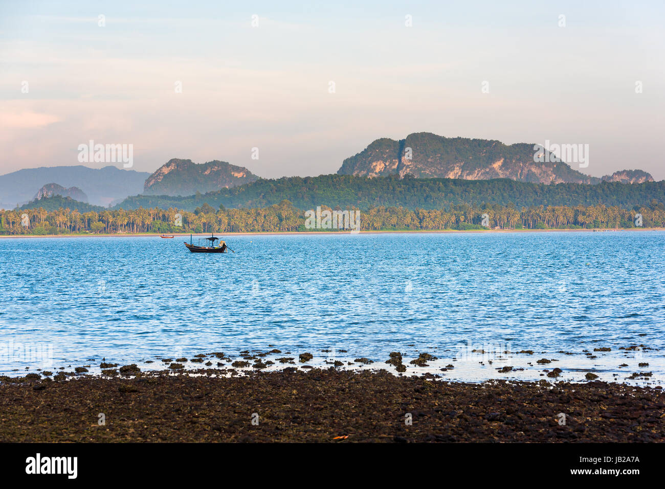 Fishing boat in the morning sea in thailand Stock Photo - Alamy
