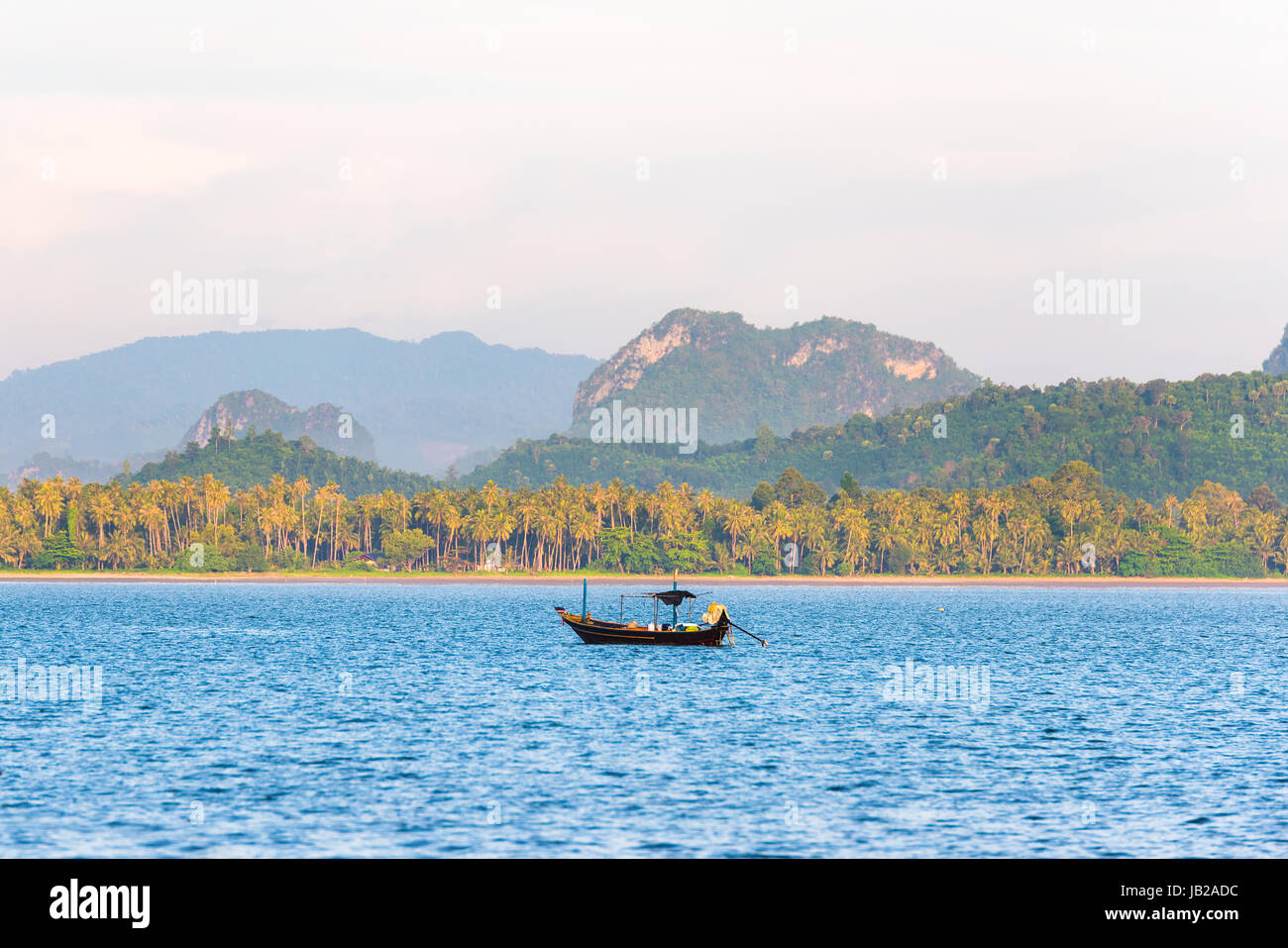Fishing boat in the morning sea in thailand Stock Photo - Alamy