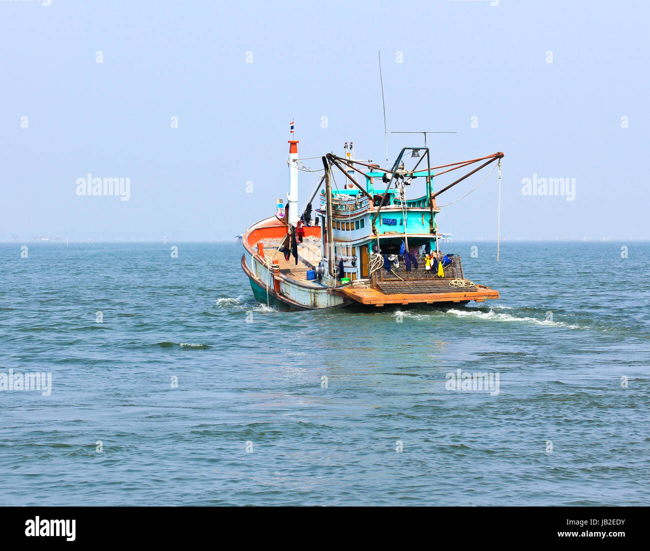 Wooden fishing boat on sea Stock Photo - Alamy