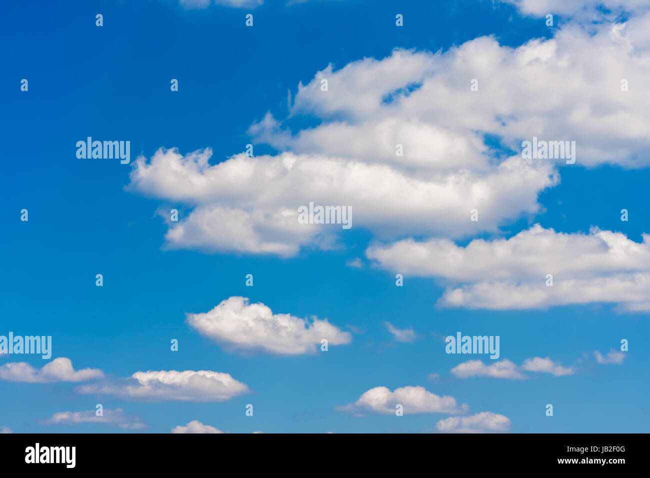 White clouds in blue summer sky background Stock Photo - Alamy