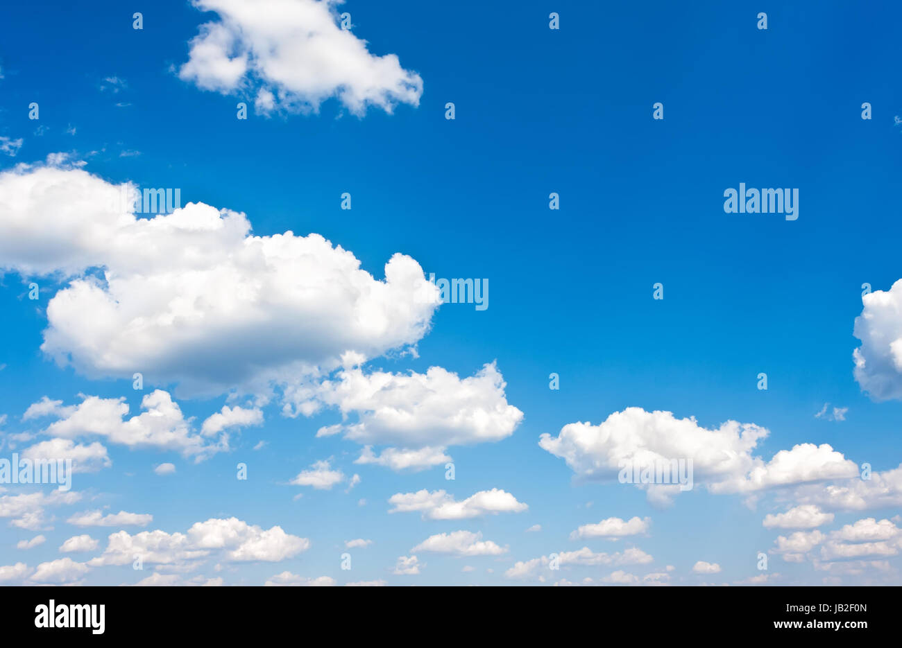 White clouds in blue summer sky background Stock Photo - Alamy
