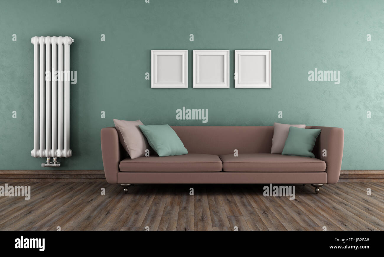 Vintage living room with elegant sofa and classic radiator on wall ...