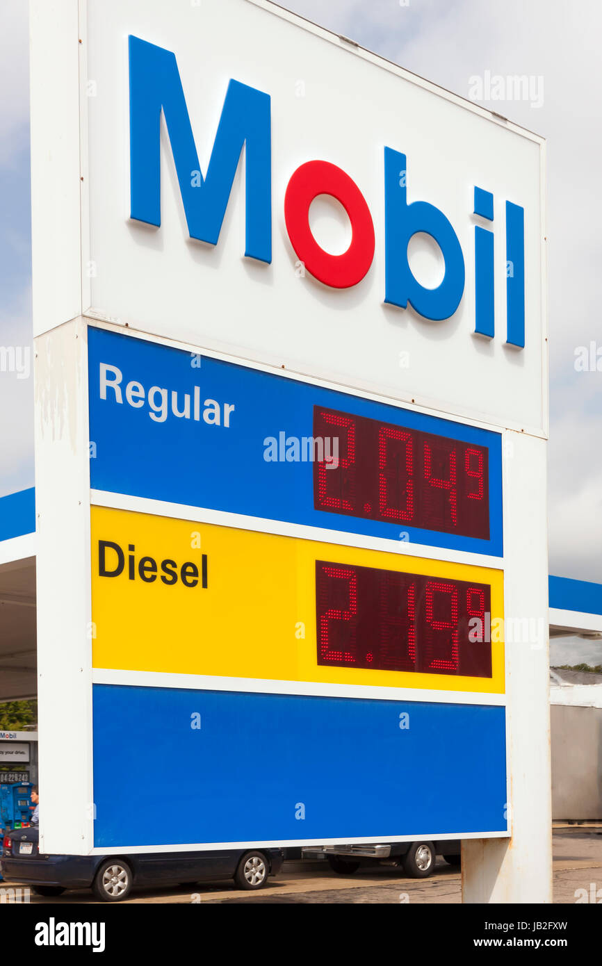 Mobil sign advertising very low prices at a gasoline station. Stock Photo