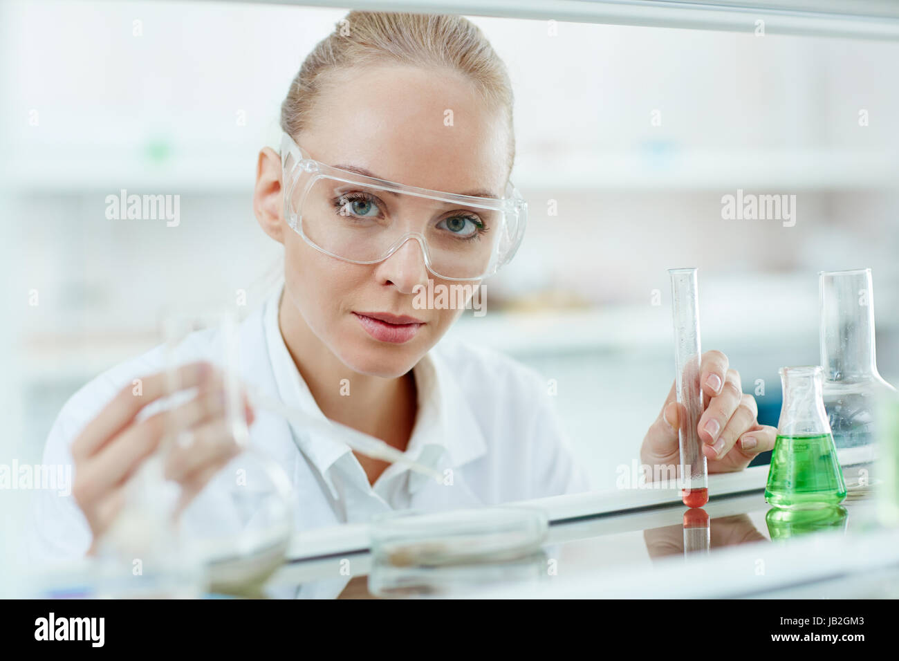 Beautiful Blond Woman Working In Laboratory Stock Photo