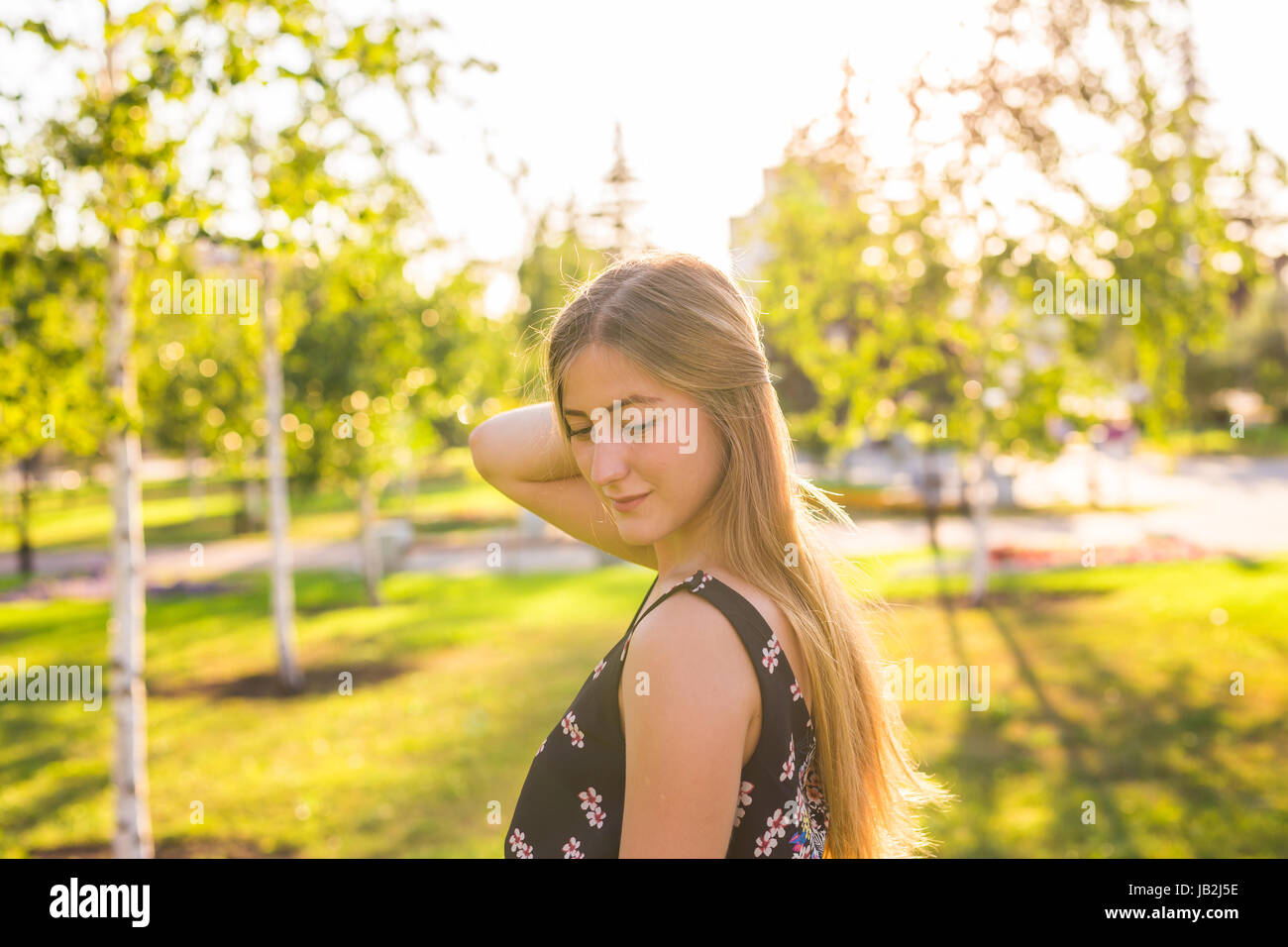 Beautiful young woman in the park. Outdoor portrait Stock Photo - Alamy