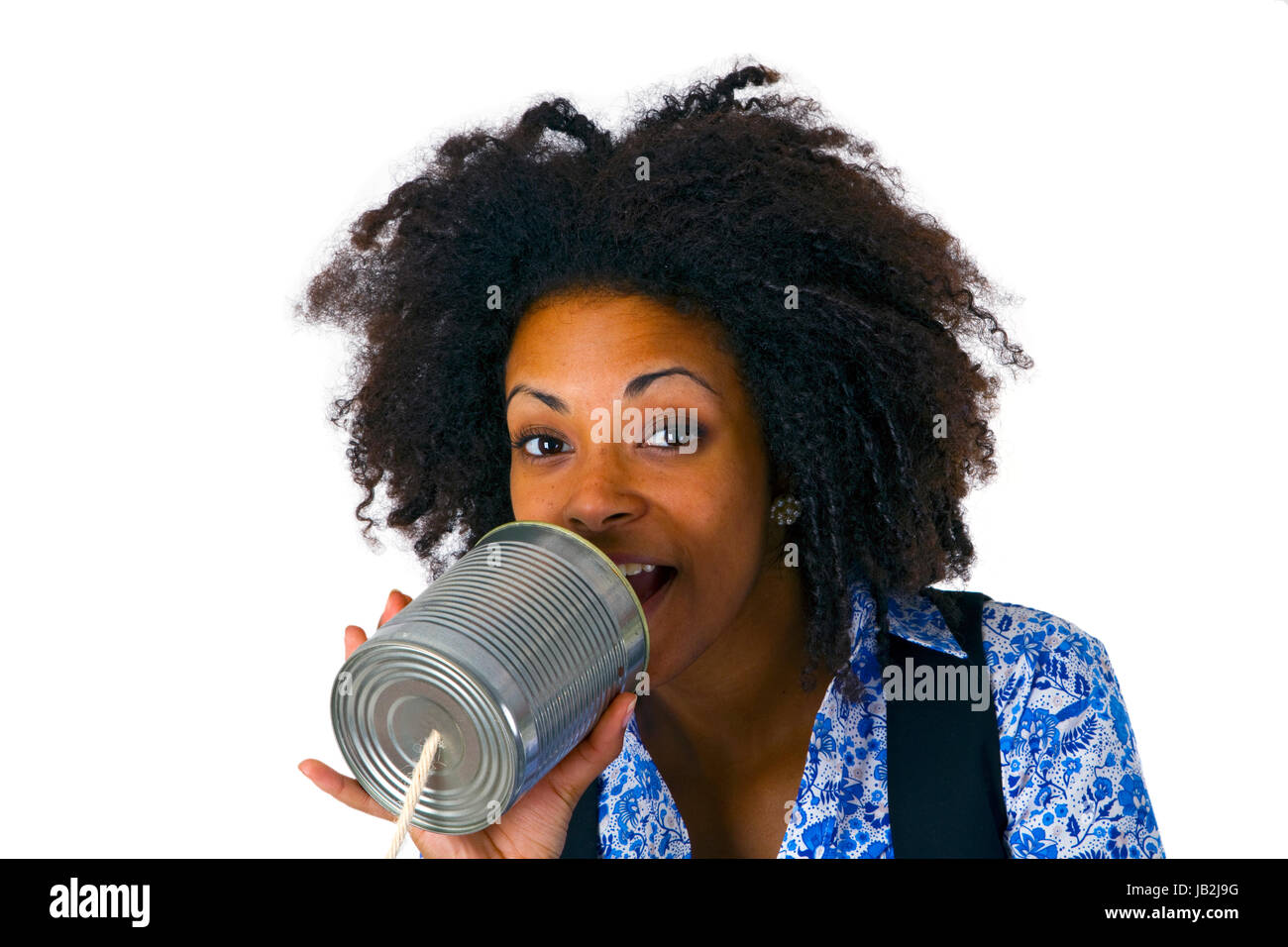 Afroamerikanische Frau mit Dosentelefon - freigestellt auf weissem Hintergrund Stock Photo