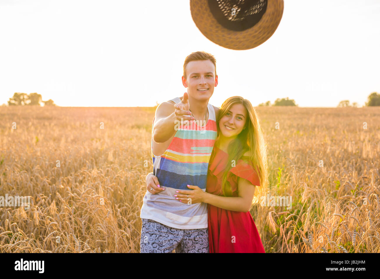 romantic couple having fun in the field Stock Photo - Alamy